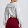 Felpa corta con zip a un quarto in grigio melange