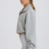 Felpa corta con zip a un quarto in grigio melange