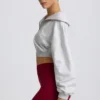 Felpa corta con zip a un quarto in grigio melange