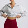 Felpa corta con zip a un quarto in grigio melange