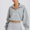 Felpa corta con zip a un quarto in grigio melange