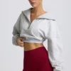 Felpa corta con zip a un quarto in grigio melange