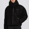 Giacca da sci oversize corta impermeabile in nero leopardato Giacca da sci oversize corta impermeabile in nero leopardato