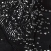 Top bikini con spalline incrociate e decorazioni Liberty in nero Top bikini con spalline incrociate e decorazioni Liberty in nero