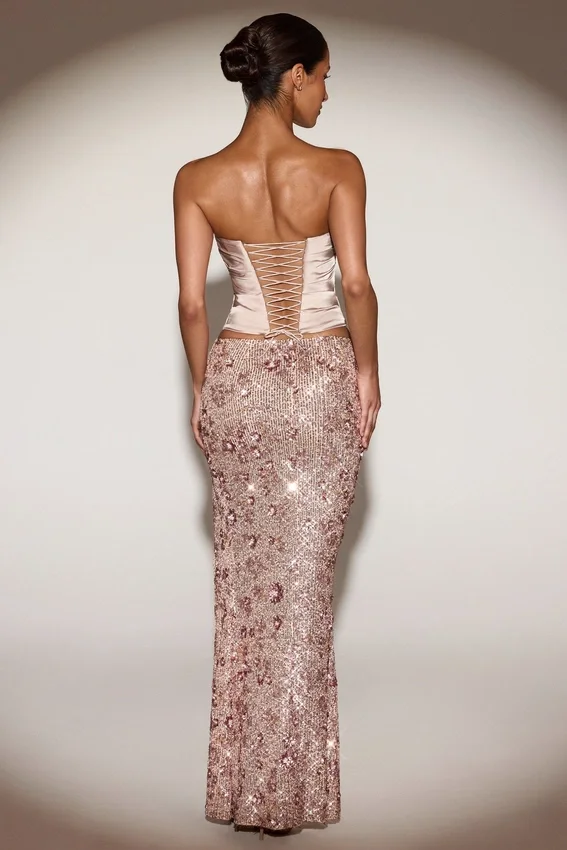 Gonna lunga a vita media con spacco sulla coscia e decorazioni Nevara in oro rosa Gonna lunga a vita media con spacco sulla coscia e decorazioni Nevara in oro rosa