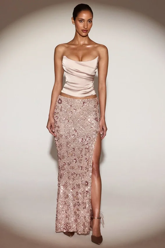 Gonna lunga a vita media con spacco sulla coscia e decorazioni Nevara in oro rosa Gonna lunga a vita media con spacco sulla coscia e decorazioni Nevara in oro rosa