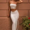 Gonna lunga Pelagia con spacco sulla coscia e vita a V decorata in bianco Gonna lunga Pelagia con spacco sulla coscia e vita a V decorata in bianco