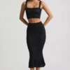Gonna midi Yasira in maglia pointelle con bordi arricciati, colore nero Gonna midi Yasira in maglia pointelle con bordi arricciati, colore nero
