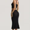Gonna midi Yasira in maglia pointelle con bordi arricciati, colore nero Gonna midi Yasira in maglia pointelle con bordi arricciati, colore nero