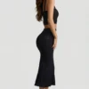 Gonna midi Yasira in maglia pointelle con bordi arricciati, colore nero Gonna midi Yasira in maglia pointelle con bordi arricciati, colore nero
