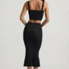 Gonna midi Yasira in maglia pointelle con bordi arricciati, colore nero Gonna midi Yasira in maglia pointelle con bordi arricciati, colore nero