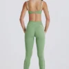 Leggings Soft Active con parte anteriore intrecciata in verde