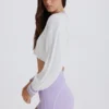 Maglione corto in maglia a trecce di cotone nei colori Lilla e Avorio Maglione corto in maglia a trecce di cotone nei colori Lilla e Avorio