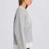 Maglione oversize con logo in maglia color ghiaccio Maglione oversize con logo in maglia color ghiaccio