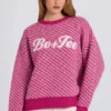 Maglione oversize in maglia con logo in rosa magenta Maglione oversize in maglia con logo in rosa magenta