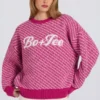 Maglione oversize in maglia con logo in rosa magenta Maglione oversize in maglia con logo in rosa magenta