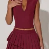 Mini gonna a pieghe a strati a vita bassa Nada in rosso vino Mini gonna a pieghe a strati a vita bassa Nada in rosso vino
