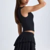 Mini gonna a pieghe a vita bassa Nada in nero Mini gonna a pieghe a vita bassa Nada in nero