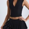Mini gonna a pieghe a vita bassa Nada in nero Mini gonna a pieghe a vita bassa Nada in nero