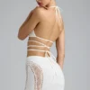 Top bikini Liberty con spalline incrociate e decorazioni in avorio Top bikini Liberty con spalline incrociate e decorazioni in avorio