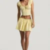 Mini gonna in popeline di cotone con ruches Maira in giallo limone Mini gonna in popeline di cotone con ruches Maira in giallo limone