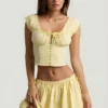 Mini gonna in popeline di cotone con ruches Maira in giallo limone Mini gonna in popeline di cotone con ruches Maira in giallo limone