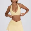 Mini gonna-pantaloncino incrociata in jersey spazzolato melange limone Mini gonna-pantaloncino incrociata in jersey spazzolato melange limone