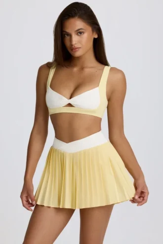 Mini gonna-pantaloncino plissettata Soft Active con incrocio in giallo limone Mini gonna-pantaloncino plissettata Soft Active con incrocio in giallo limone