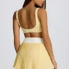 Mini gonna-pantaloncino plissettata Soft Active con incrocio in giallo limone