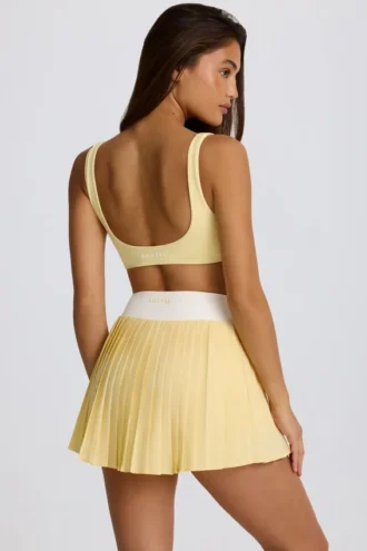 Mini gonna-pantaloncino plissettata Soft Active con incrocio in giallo limone Mini gonna-pantaloncino plissettata Soft Active con incrocio in giallo limone