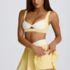 Mini gonna-pantaloncino plissettata Soft Active con incrocio in giallo limone