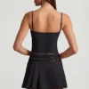 Mini gonna plissettata a vita bassa con cintura Velora in nero Mini gonna plissettata a vita bassa con cintura Velora in nero