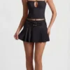 Mini gonna plissettata a vita bassa con cintura Velora in nero Mini gonna plissettata a vita bassa con cintura Velora in nero