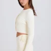 Mini shorts con laccio in maglia a costine color crema Mini shorts con laccio in maglia a costine color crema