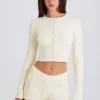 Mini shorts con laccio in maglia a costine color crema Mini shorts con laccio in maglia a costine color crema