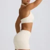 Mini shorts con ruches in avorio melange Mini shorts con ruches in avorio melange