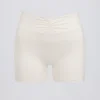 Mini shorts con ruches in avorio melange Mini shorts con ruches in avorio melange