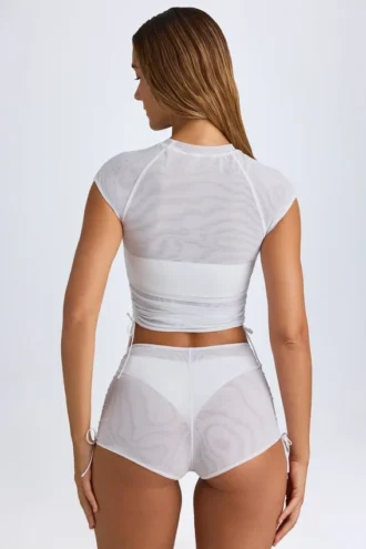 Mini shorts trasparenti con arricciature Rocas in bianco