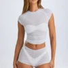 Mini shorts trasparenti con arricciature Rocas in bianco