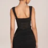 Miniabito con gonna drappeggiata e corsetto Miller in nero Miniabito con gonna drappeggiata e corsetto Miller in nero
