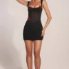 Miniabito con gonna drappeggiata e corsetto Miller in nero Miniabito con gonna drappeggiata e corsetto Miller in nero