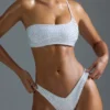Oh Polly Costumi da Bagno: Top bikini a fascia monospalla decorato HOTFIX Edition in bianco Oh Polly Costumi da Bagno: Top bikini a fascia monospalla decorato HOTFIX Edition in bianco