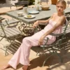 Pantaloni a gamba larga in popeline di cotone Dalila a righe rosa e bianche Pantaloni a gamba larga in popeline di cotone Dalila a righe rosa e bianche