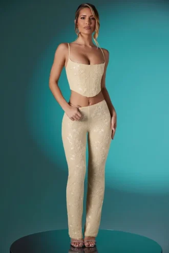 Pantaloni a vita bassa in pizzo decorato Fallon Petite in avorio