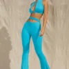 Pantaloni a zampa con cut-out Valerie Petite in acquamarina Pantaloni a zampa con cut-out Valerie Petite in acquamarina