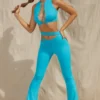 Pantaloni a zampa con cut-out Valerie Petite in acquamarina Pantaloni a zampa con cut-out Valerie Petite in acquamarina