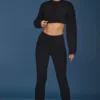 Pantaloni a zampa con risvolto in maglia a trecce, colore nero Pantaloni a zampa con risvolto in maglia a trecce, colore nero