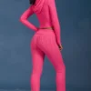 Pantaloni a zampa con risvolto in maglia a trecce rosa shocking Pantaloni a zampa con risvolto in maglia a trecce rosa shocking