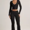 Pantaloni a zampa con risvolto in TENCEL™ Modal a coste, colore nero Pantaloni a zampa con risvolto in TENCEL™ Modal a coste, colore nero