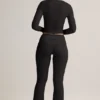 Pantaloni a zampa con risvolto in TENCEL™ Modal a coste, colore nero Pantaloni a zampa con risvolto in TENCEL™ Modal a coste, colore nero